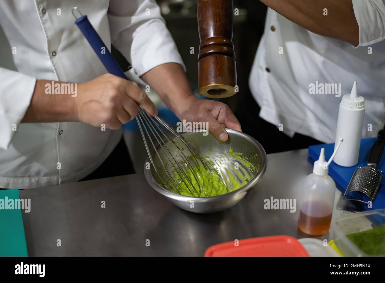 Cook mixing eggs and agar agar. whisk eggs Stock Photo