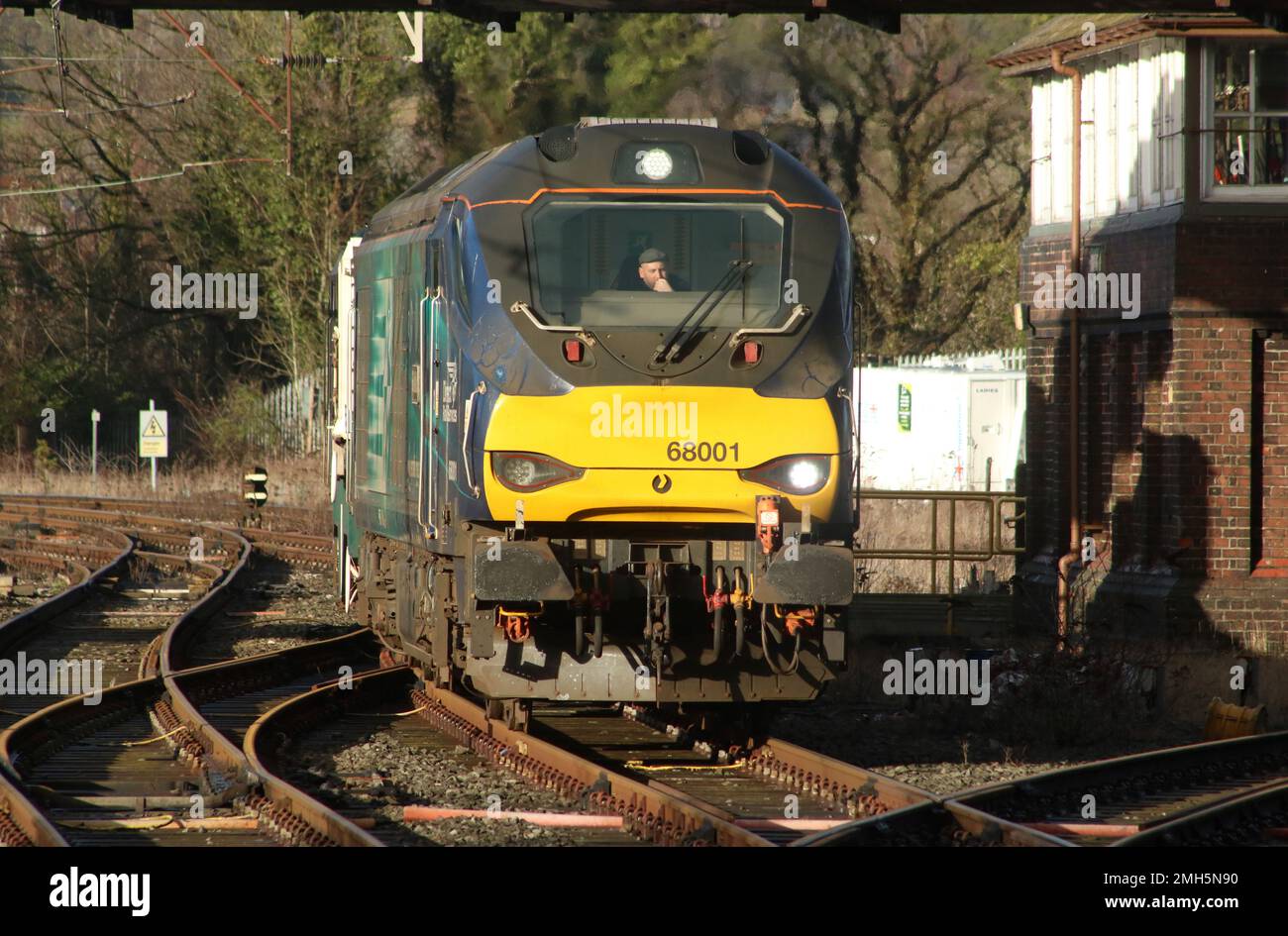Direct Rail Services locos, 68001 Evolution and 68007 Valiant, top and tail a nuclear flask train seen approaching Carnforth on 25th January 2023. Stock Photo