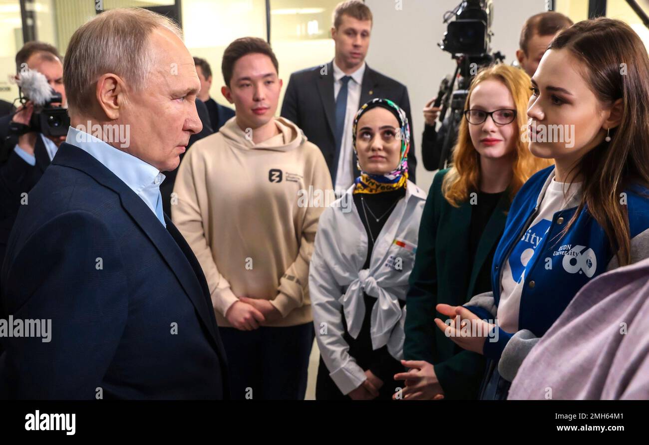 Moscow, Russia. 25th Jan, 2023. Russian President Vladimir Putin, left, listens to a university student during a meeting to mark Russian Students Day at the Vorobyovy Gory Innovation Science and Technology Centre of Moscow State University, January 25, 2023 in Moscow, Russia. Credit: Maksim Mishin/Kremlin Pool/Alamy Live News Stock Photo