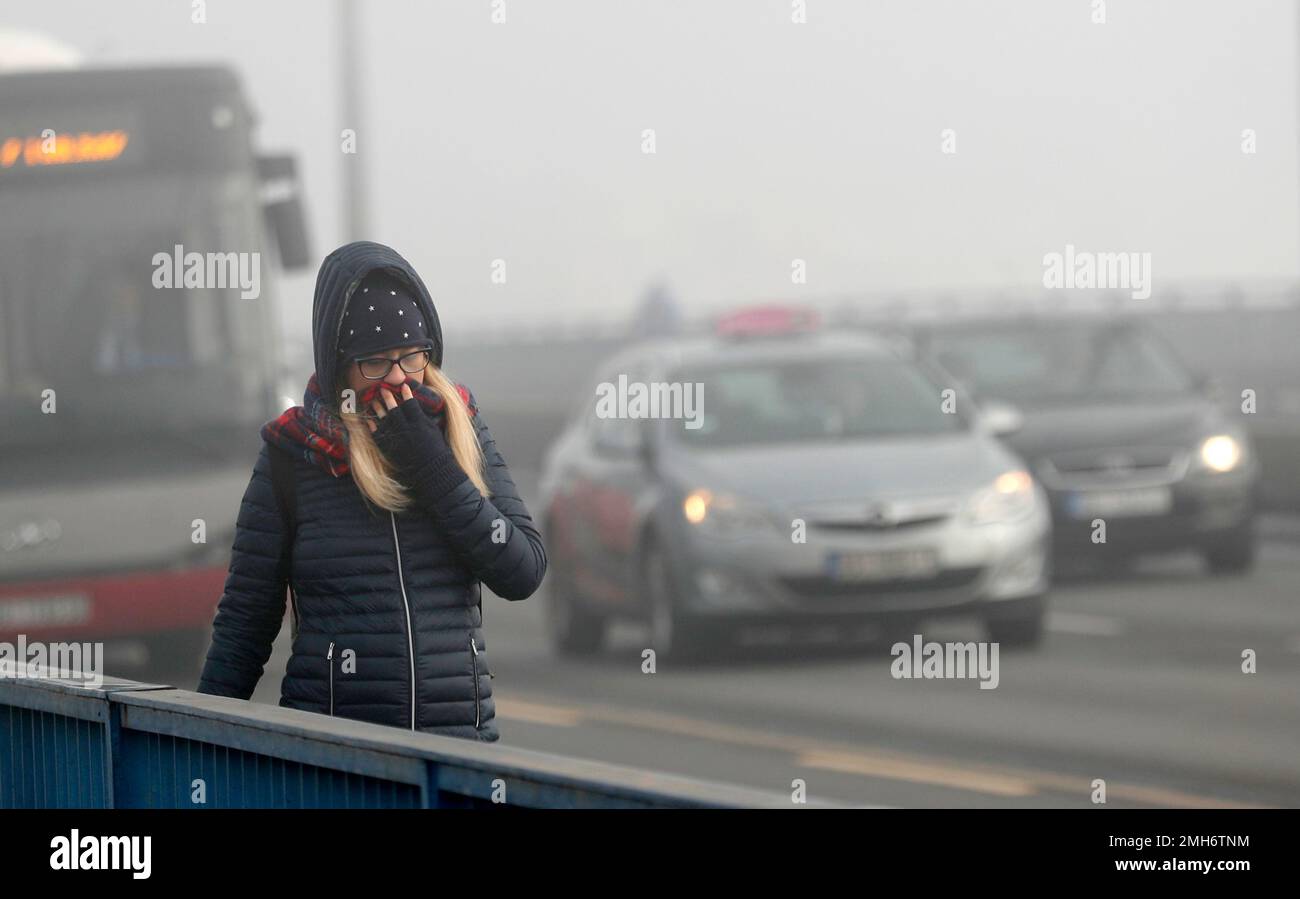 A girl walks across a bridge in Belgrade, Serbia, Wednesday, Jan. 15