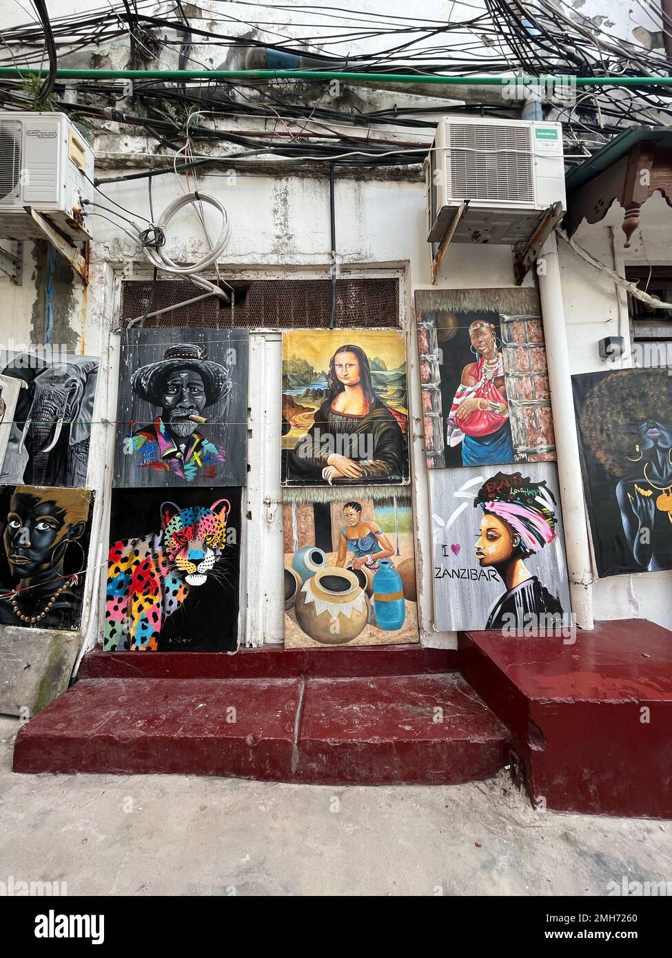 Paintings from unknown local artists are in store at traditional arts and crafts markets on the street—popular street markets with typical Indonesian Stock Photo