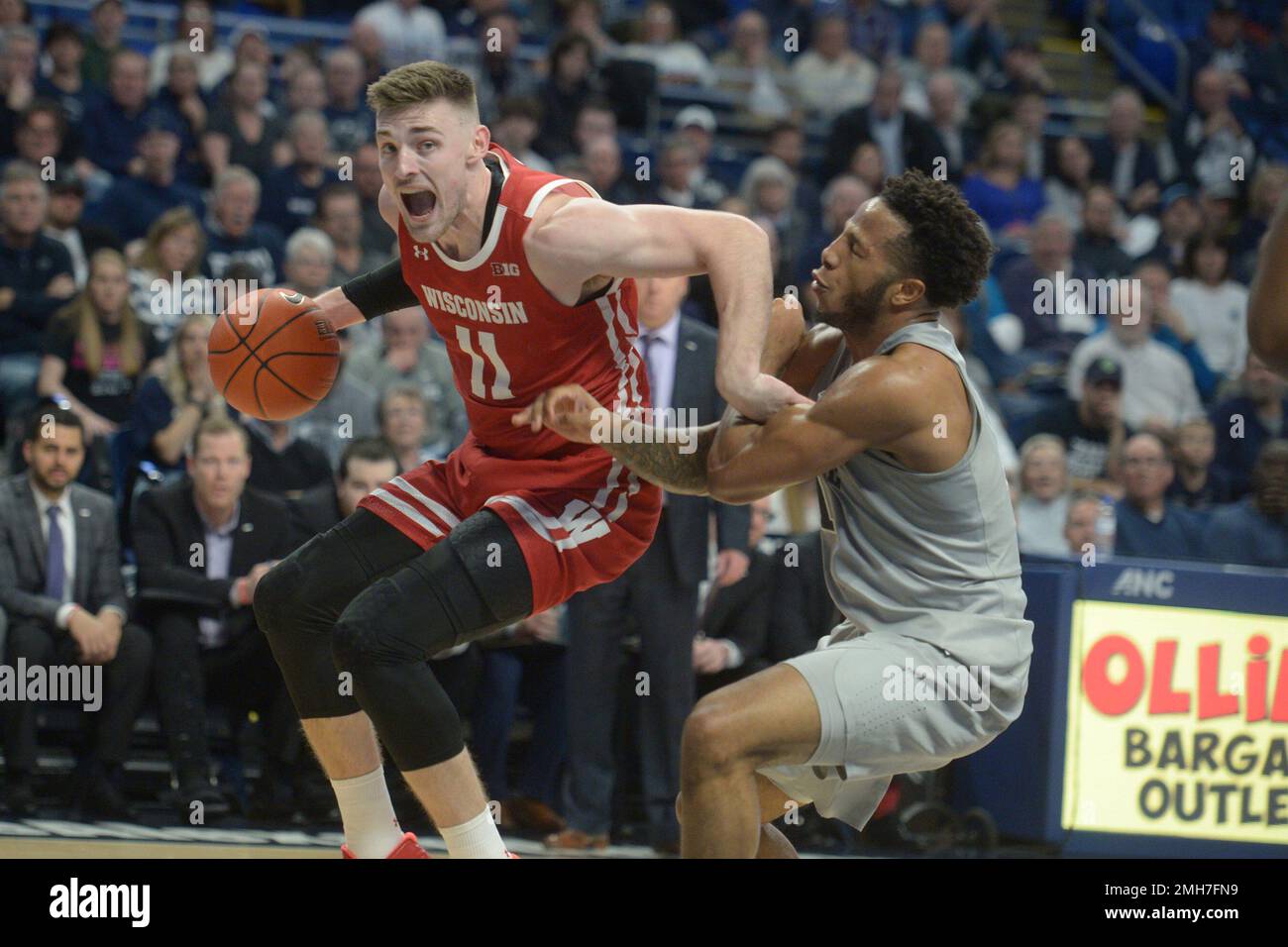 Wisconsin's Micah Potter (11) goes to the basket against Penn State's