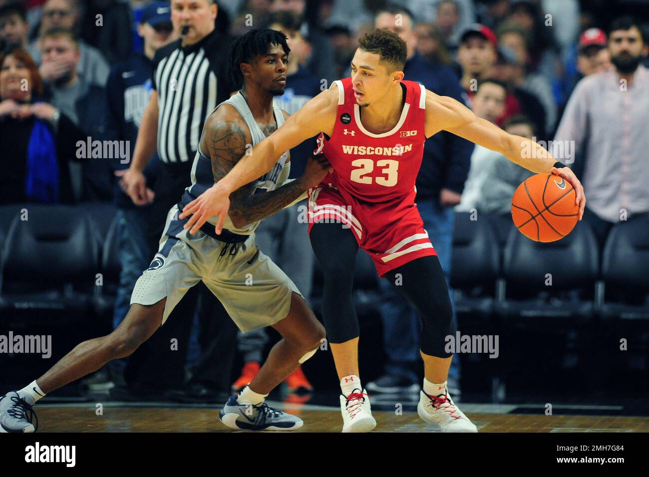 Wisconsin's Kobe King (23) works against Penn State's Jamari Wheeler (5