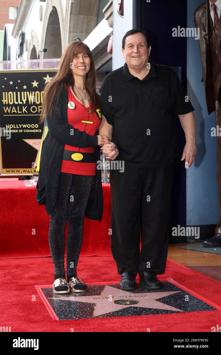 Tracy Posner, left, and Burt Ward pose for a photo following a ceremony
