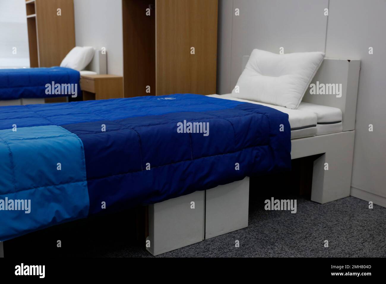 Two sets of bedroom furniture, including cardboard beds, for the Tokyo