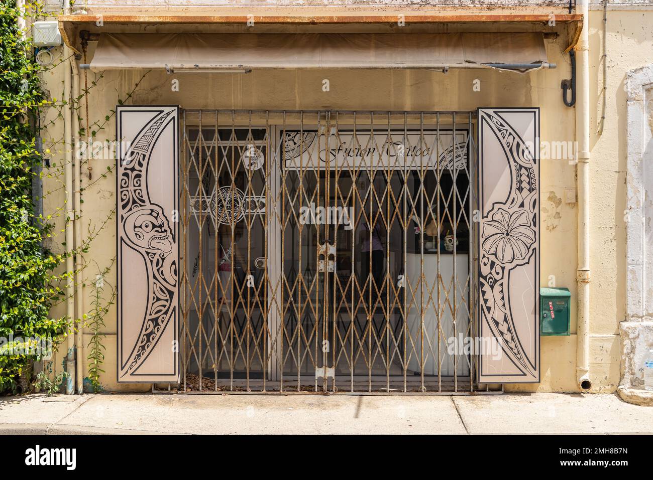 Aigues-Mortes, Gard, Occitania, France. July 4, 2022. Locked and gated small store in southern France. Stock Photo