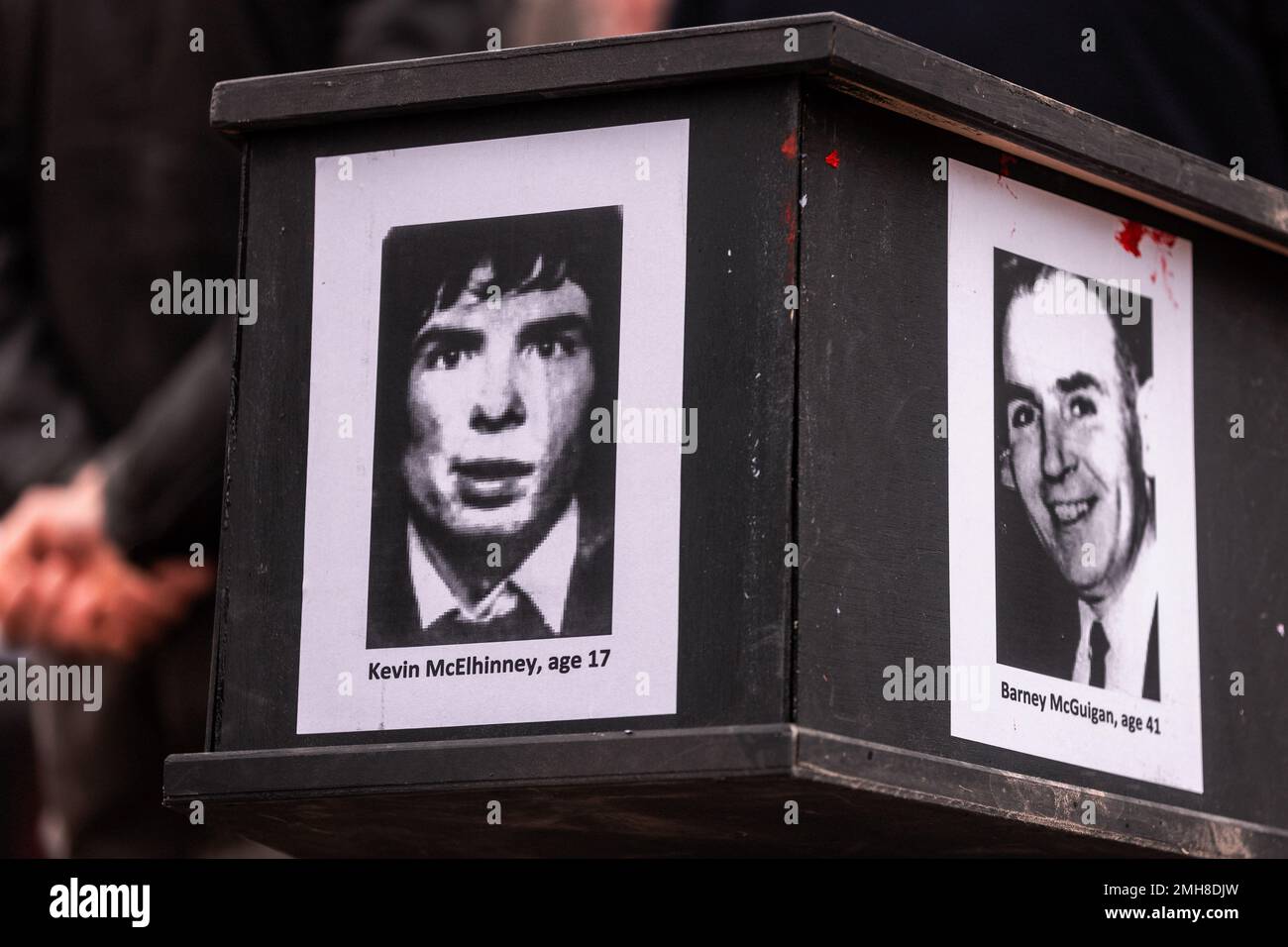 London, UK. 26 January, 2023. Images of Kevin McElhinney and Barney McGuigan are pictured on the side of a coffin during a vigil to commemorate the 51st anniversary of the Bloody Sunday massacre held in Parliament Square. On 30 January 1972, 13 people were shot dead and at least 15 others injured when members of the Parachute Regiment opened fire on civilians at a civil rights protest in the Bogside. Speakers at the vigil, who included Jean Hegarty, the sister of Bloody Sunday victim Kevin McElhinney, John Finucane MP and John McDonnell MP, called for the scrapping of the Northern Ireland Trou Stock Photo