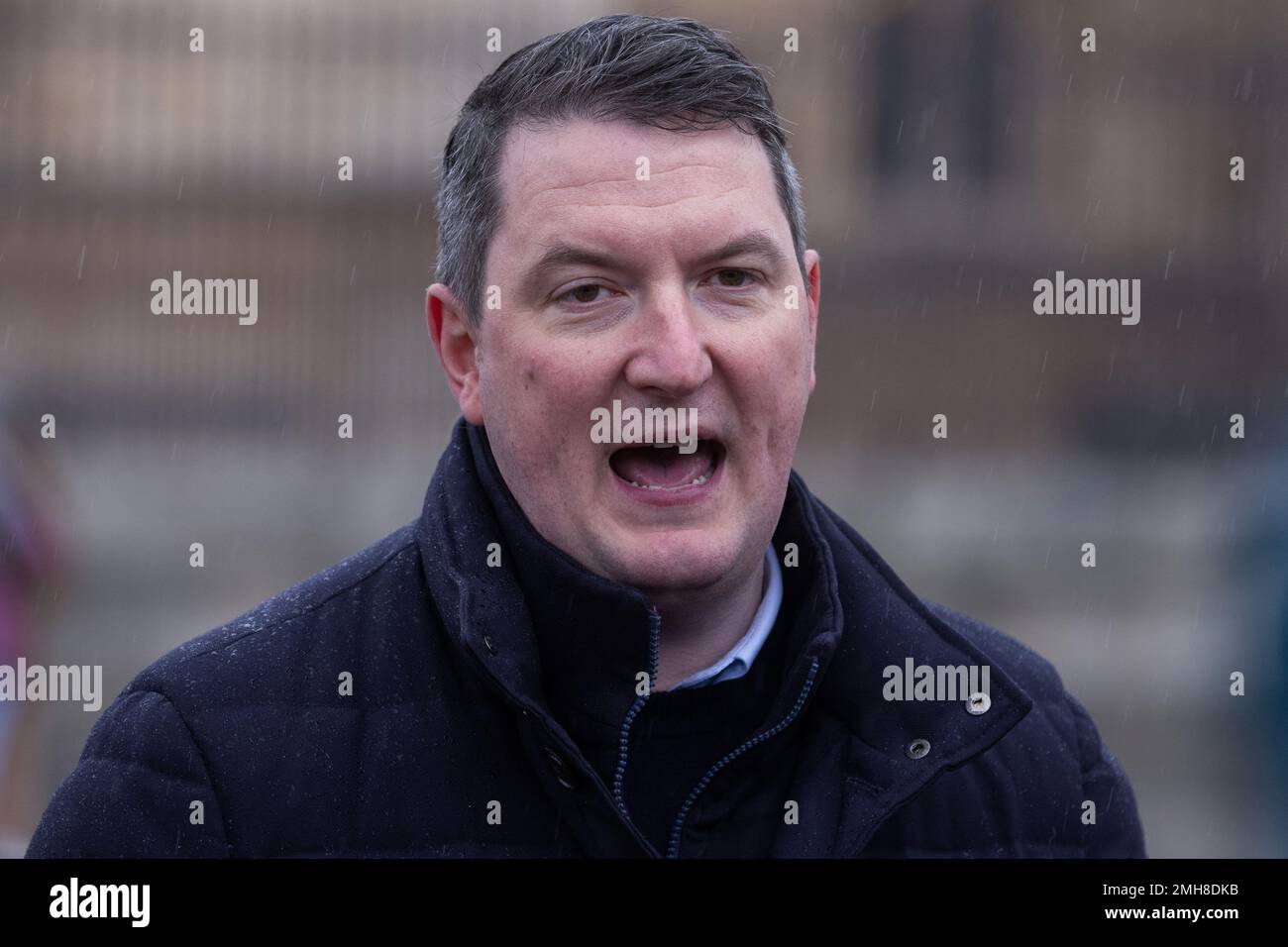 London, UK. 26 January, 2023. John Finucane, Sinn Fein MP for Belfast North, addresses a vigil to commemorate the 51st anniversary of the Bloody Sunday massacre held in Parliament Square. On 30 January 1972, 13 people were shot dead and at least 15 others injured when members of the Parachute Regiment opened fire on civilians at a civil rights protest in the Bogside. Speakers at the vigil, who also included Jean Hegarty, the sister of Bloody Sunday victim Kevin McElhinney and John McDonnell MP, called for the scrapping of the Northern Ireland Troubles Bill. Credit: Mark Kerrison/Alamy Live New Stock Photo