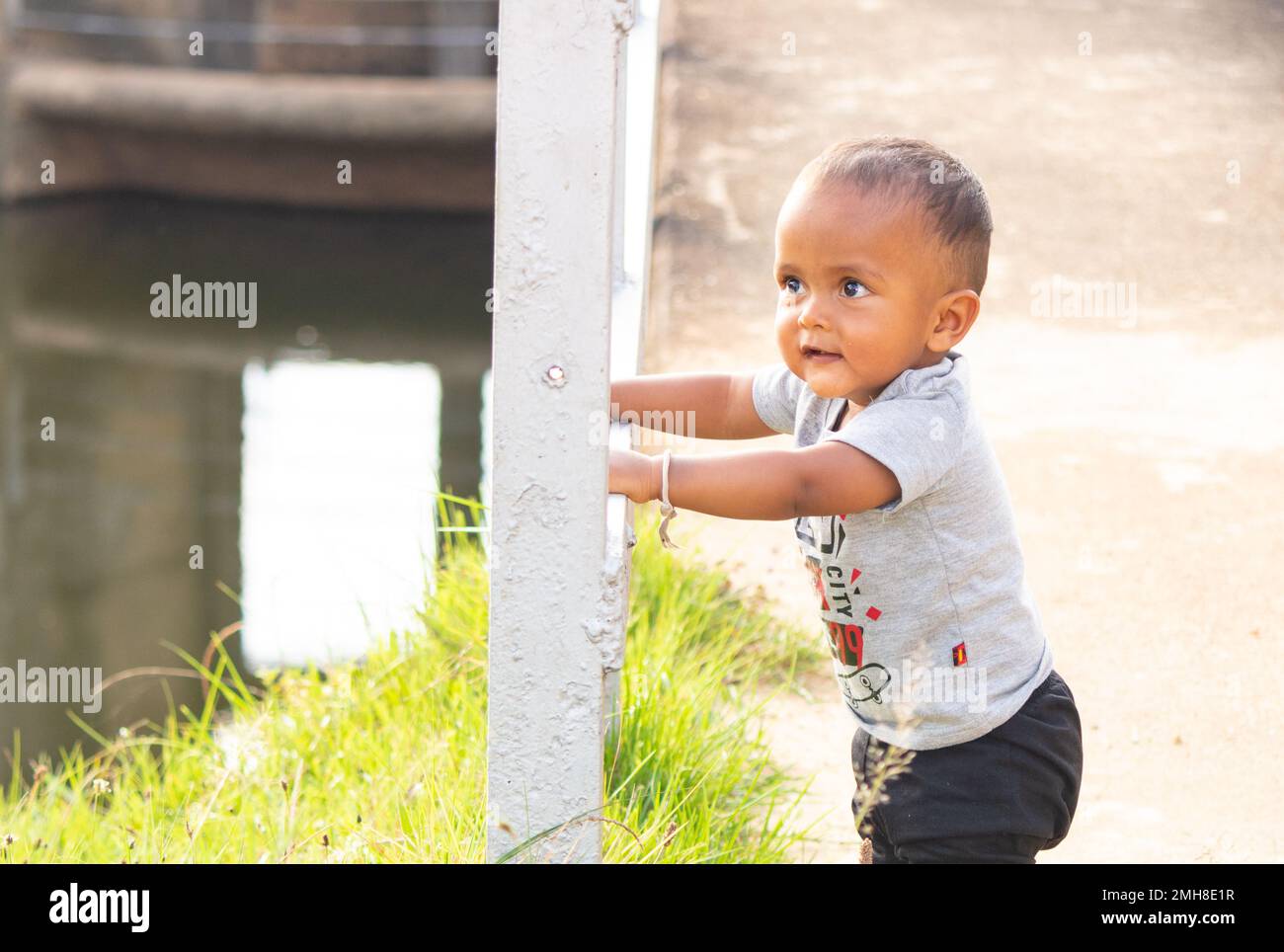 small baby boy stand up with the support Stock Photo Alamy