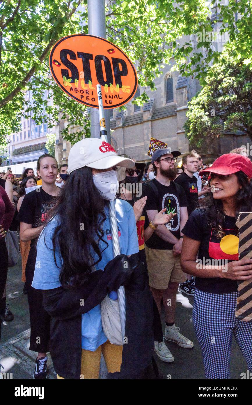 Melbourne, Australia, 26 January, 2023. A protester with a stop sign that reads 'stop killing aboriginal people' during the annual Invasion Day protest in Melbourne, organized by Indigenous Australians and their allies, calls for an end to the celebration of Australia Day and for the recognition of Indigenous sovereignty. Credit: Michael Currie/Speed Media/Alamy Live News Stock Photo