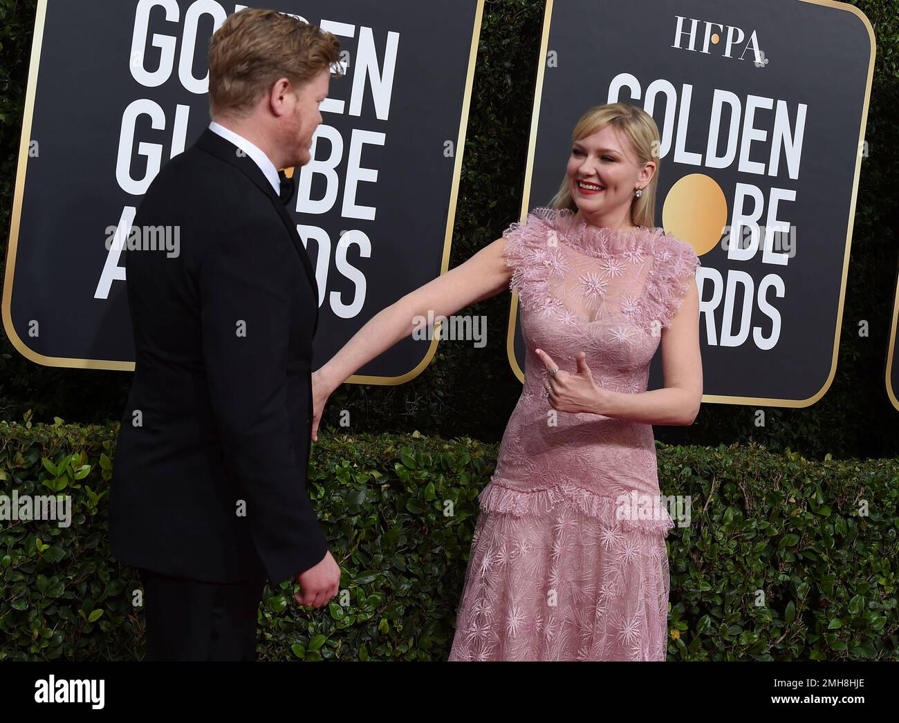 Kirsten Dunst, right, and Jesse Plemons arrive at the 77th annual
