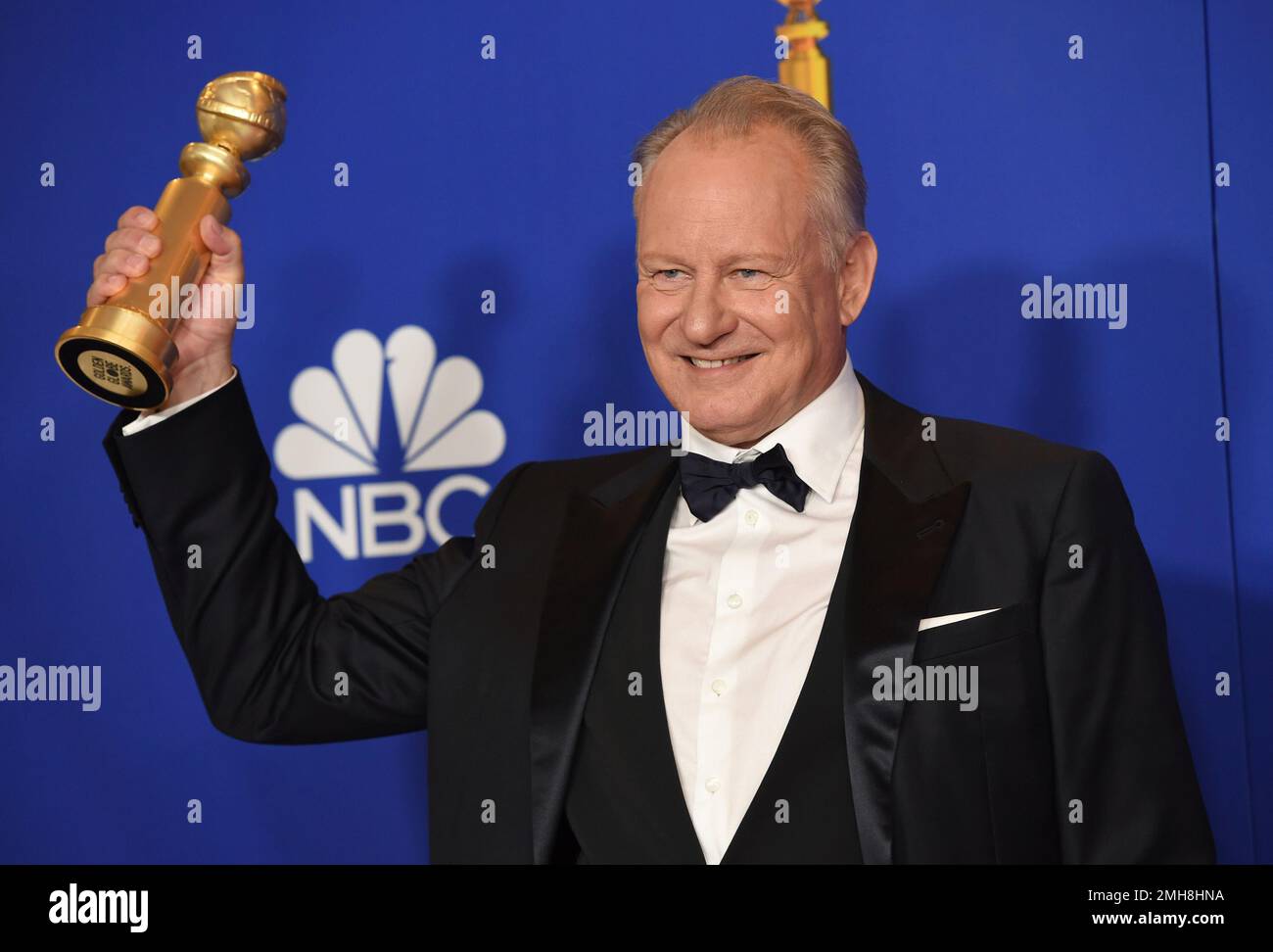 Stellan Skarsgard poses in the press room with the award for best