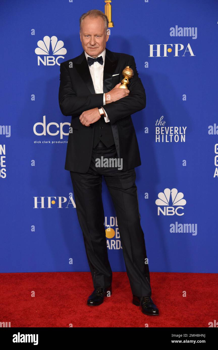 Stellan Skarsgard poses in the press room with the award for best(02)