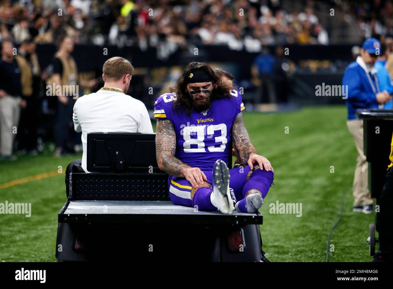 An injured Minnesota Vikings tight end Tyler Conklin (83) is