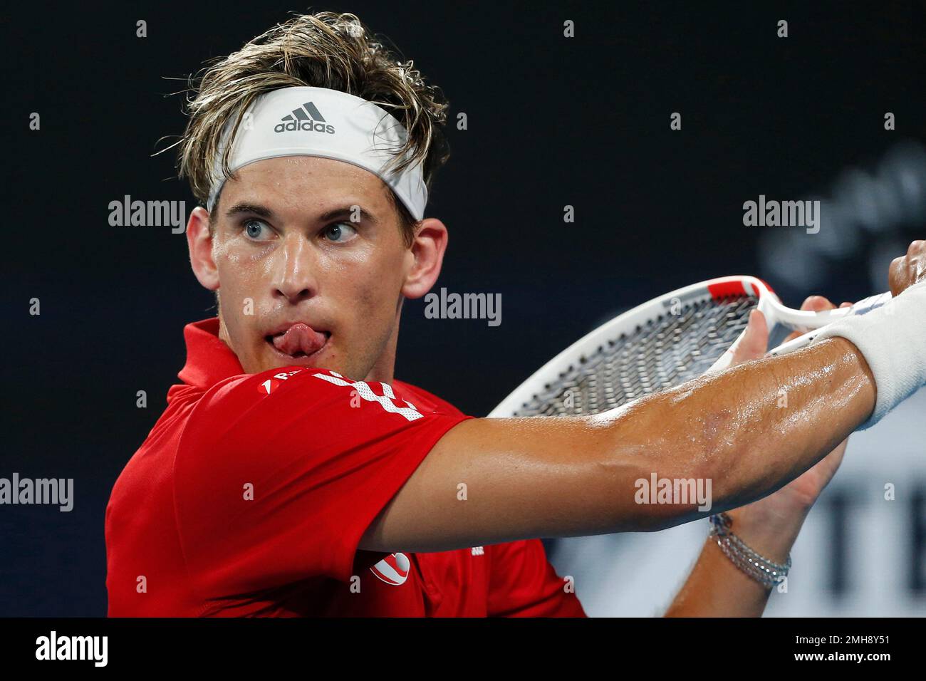 Dominic Thiem of Austria returns the ball against Borna Coric of Croatia  during their ATP Cup tennis match in Sydney, Saturday, Jan. 4, 2020. (AP  Photo/Steve Christo Stock Photo - Alamy