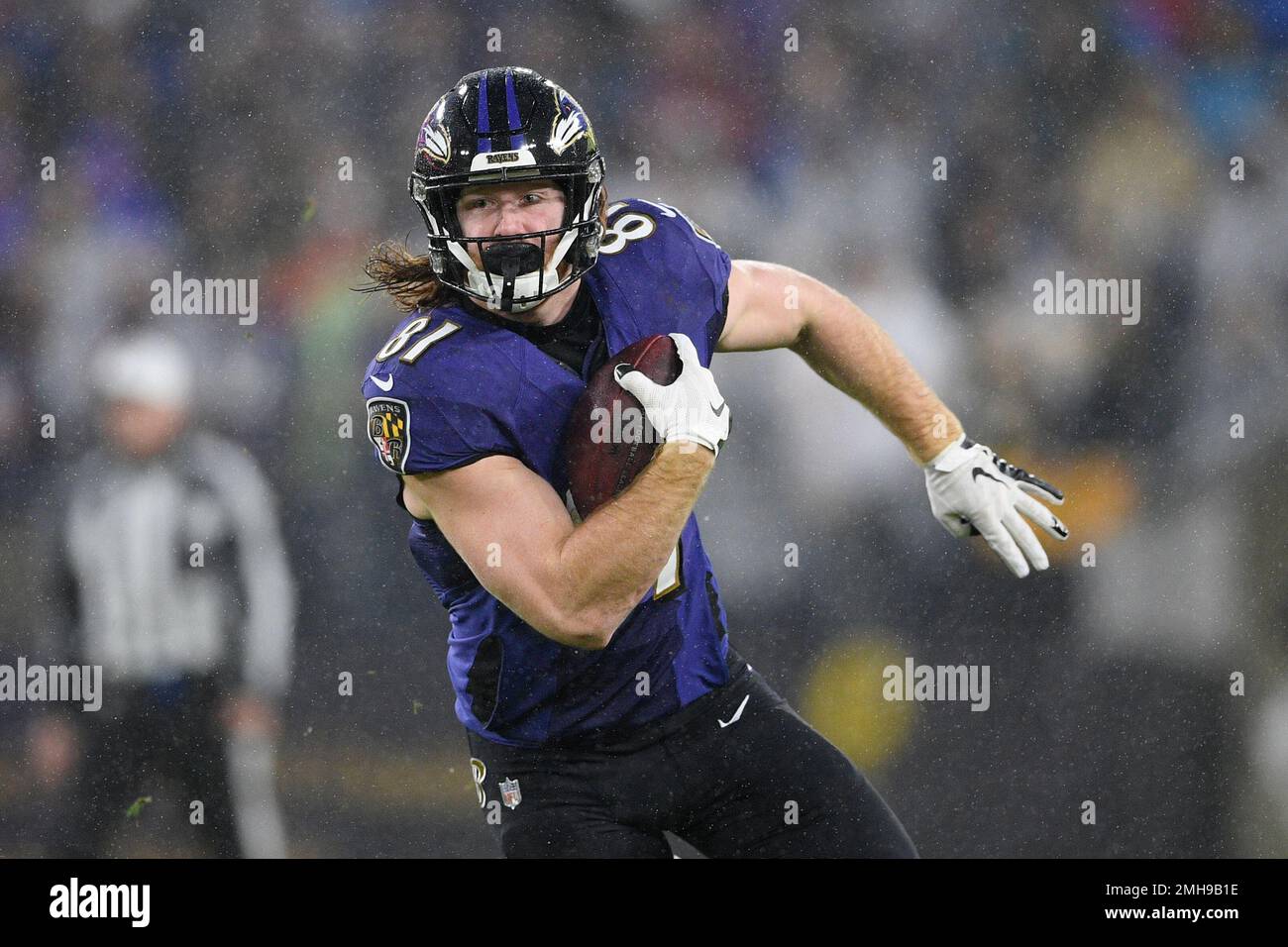 Baltimore Ravens tight end Hayden Hurst (81) runs with the ball