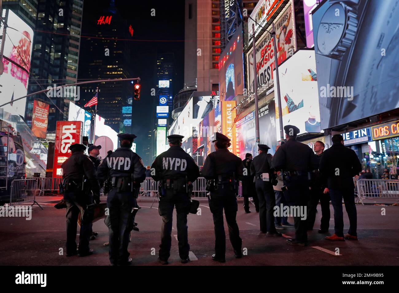 New York City police officers stand watch over revelers in New York's ...