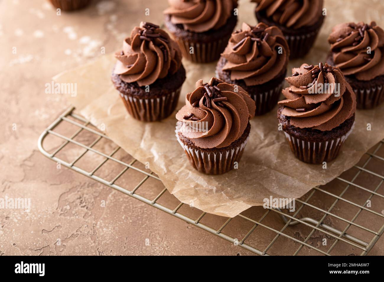 Dark chocolate cupcakes with chocolate ganache frosting Stock Photo Alamy