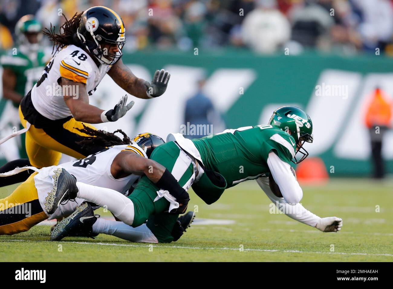 New York Jets quarterback Sam Darnold (14) is stopped in the second half of  an NFL