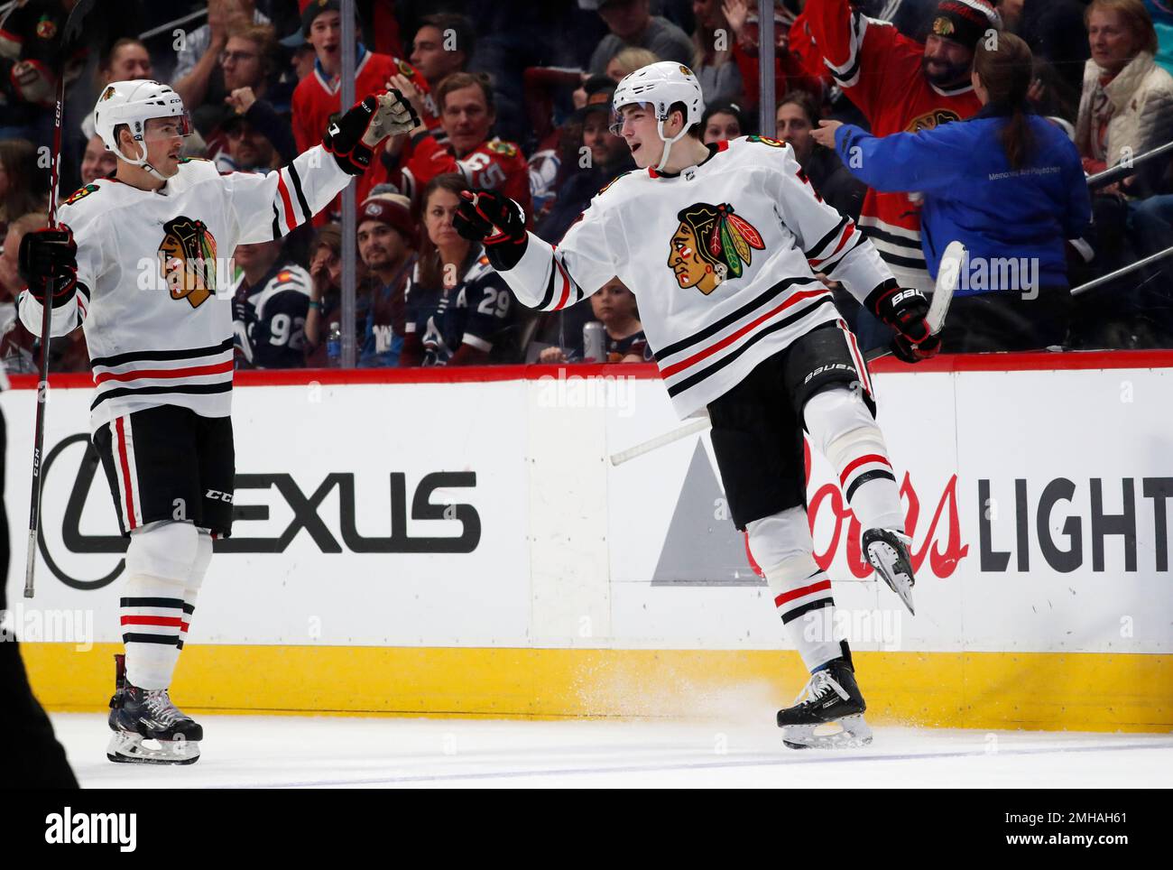 Chicago Blackhawks center Kirby Dach, right, celebrates his tying