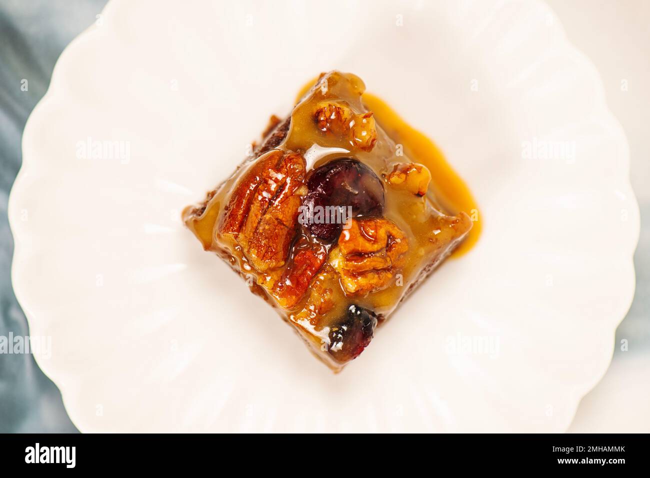 Indulgent German chocolate brownie topped with walnuts and cranberries