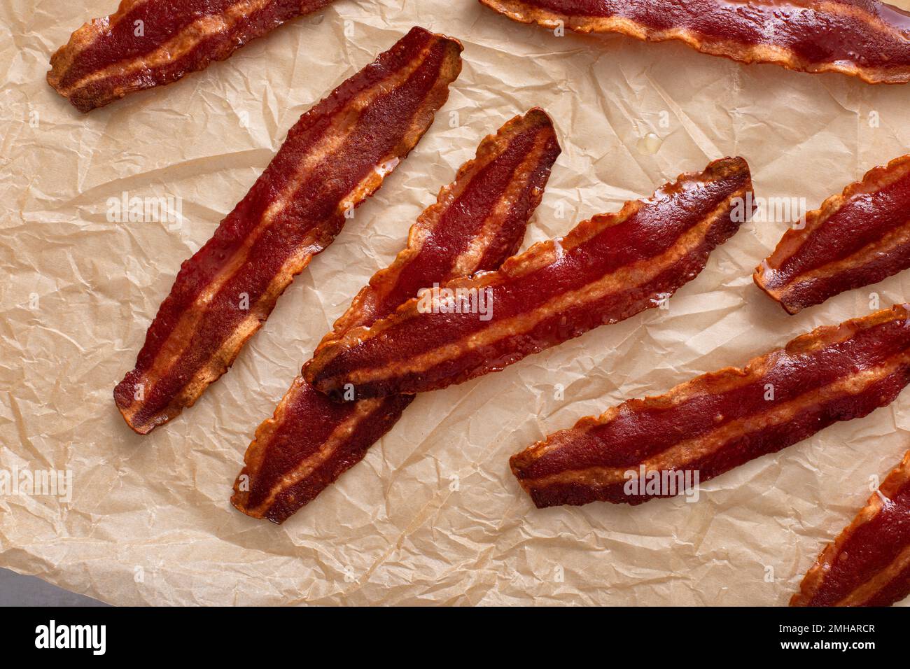 Turkey bacon crispy cooked on parchment paper Stock Photo Alamy
