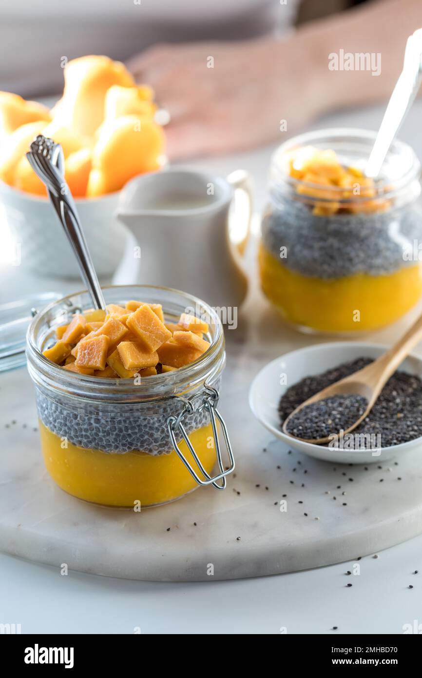 Delicious homemade chia pudding snacks with bright light in behind. Stock Photo