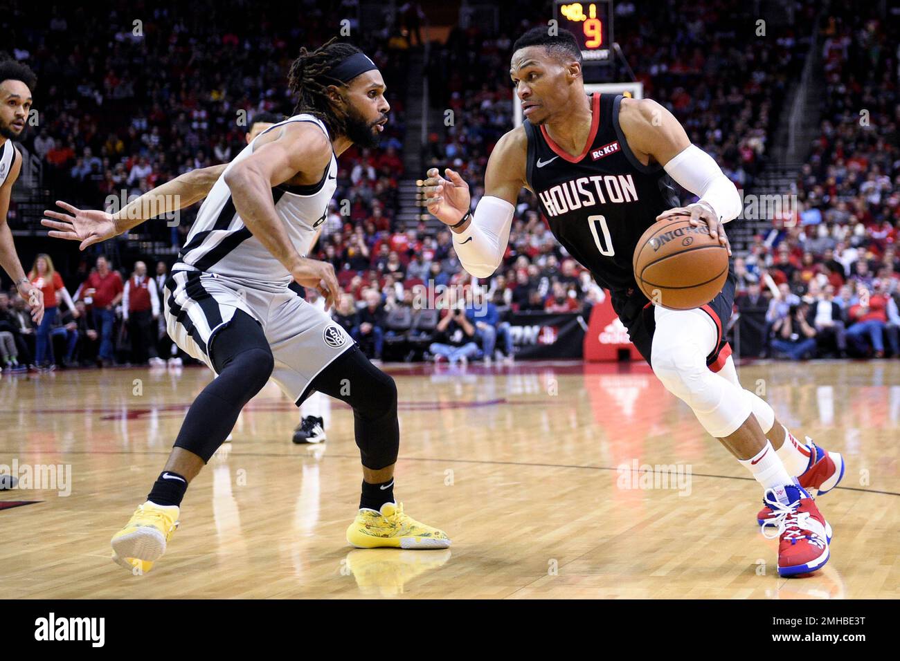 Houston Rockets guard Russell Westbrook (0) dribbles as San Antonio Spurs  guard Patty Mills defends during the first half of an NBA basketball game,  Monday, Dec. 16, 2019, in Houston. (AP Photo/Eric