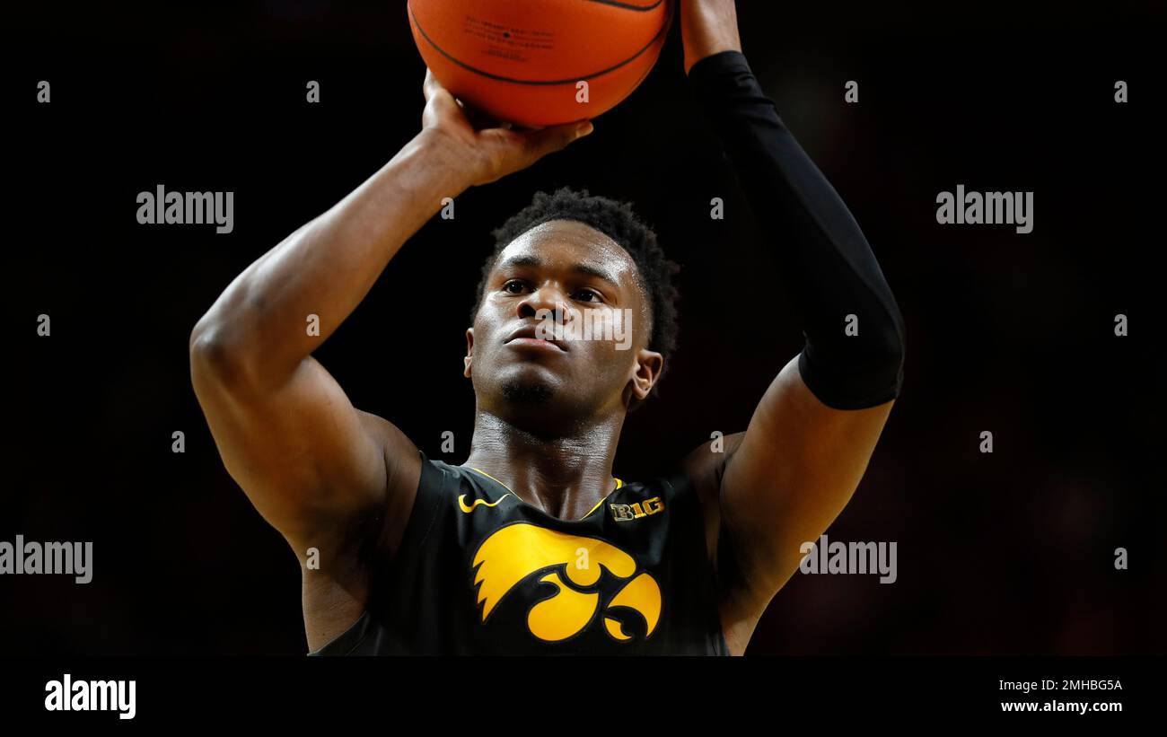 Iowa guard Joe Toussaint shoots during an NCAA college basketball game