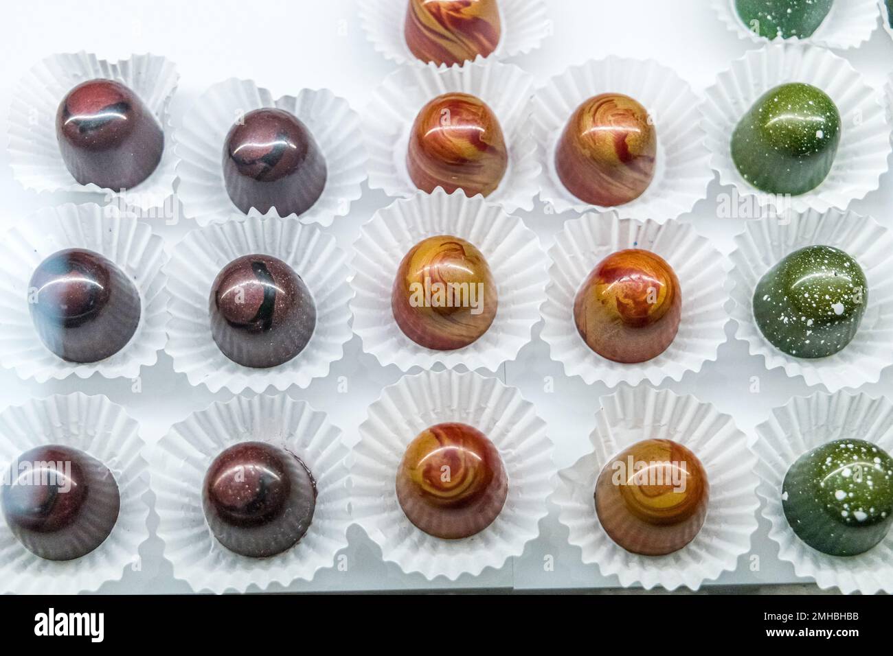 A chocolate confectionary and bakery glass display of handmade ...