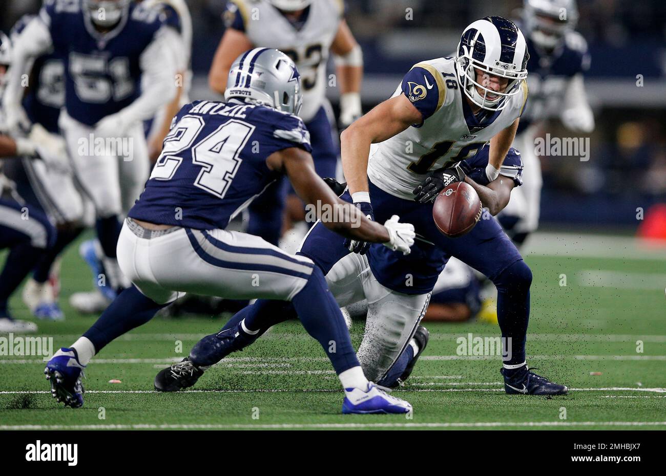 Los Angeles Rams wide receiver Cooper Kupp (18) fumbles the ball as Dallas  Cowboys cornerback Chidobe Awuzie (24) defends during an NFL football game  Sunday, Dec. 15, 2019 in Arlington, Texas. Dallas