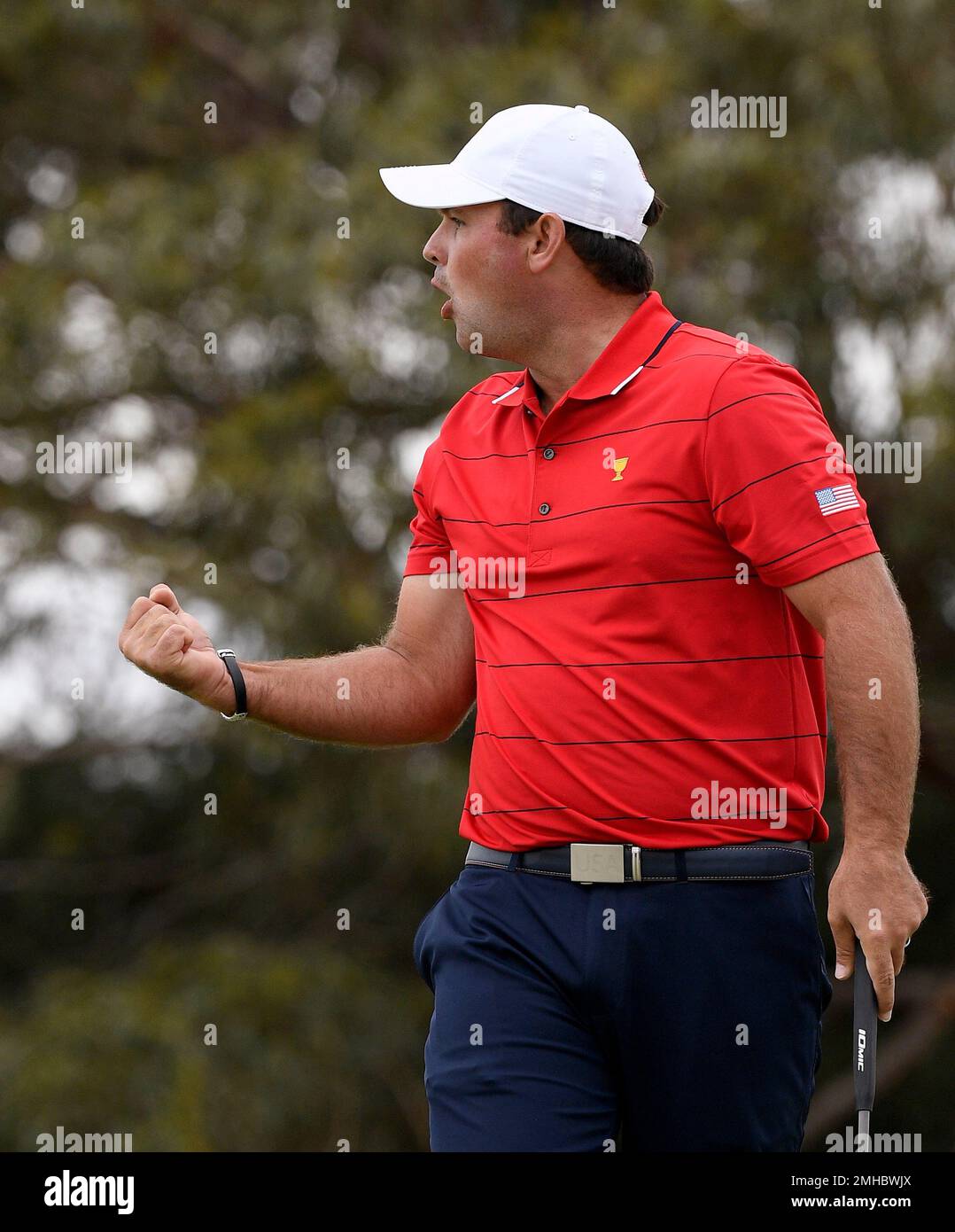 U.S. team player Patrick Reed celebrates after making a putt on the 6th