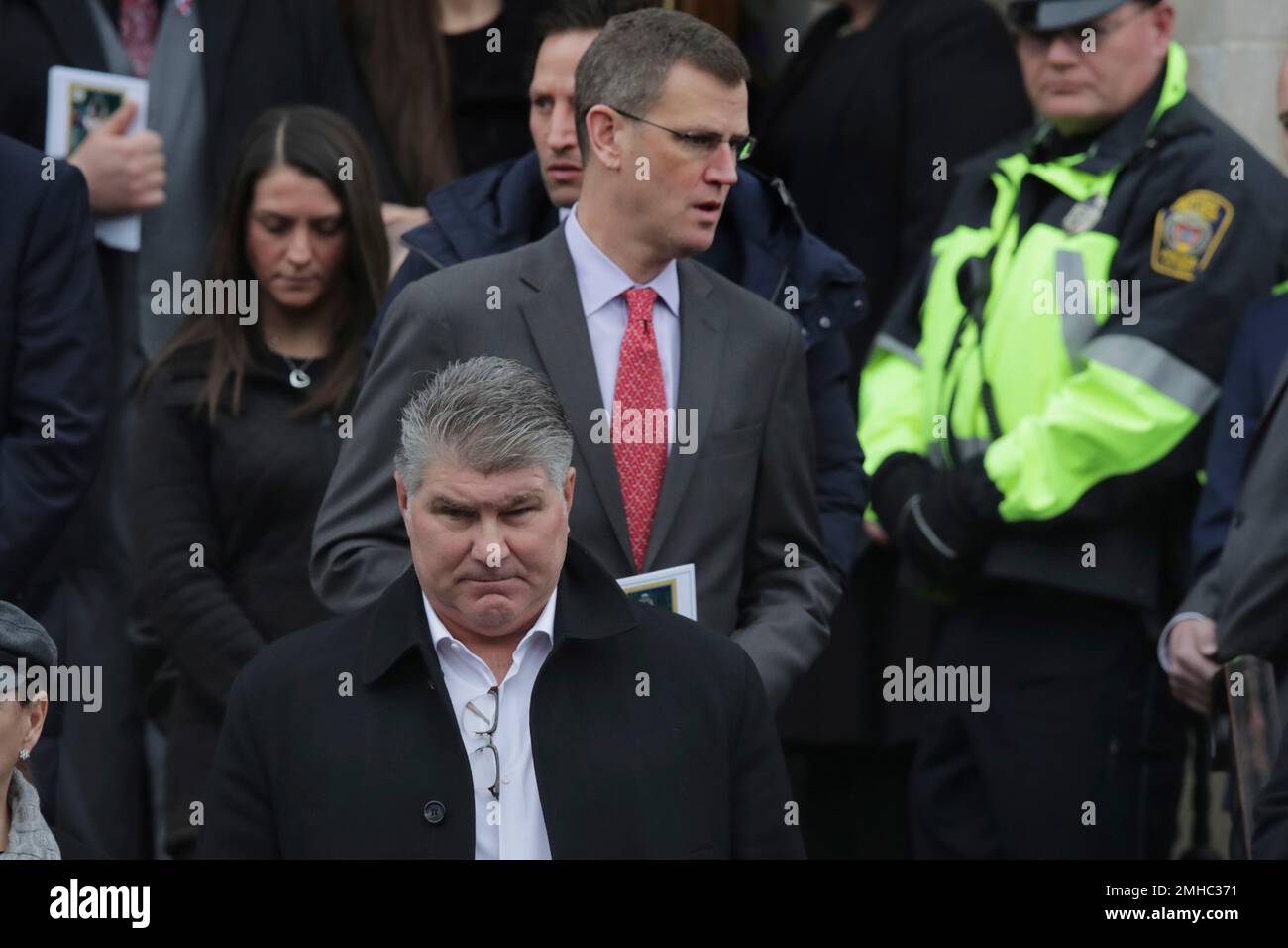 Boston Bruins great Ray Bourque, front, and Boston Red Sox CEO Sam ...