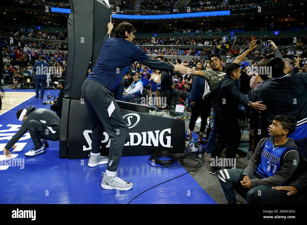 Dallas Mavericks' Boban Marjanovic shakes hands with a fan prior