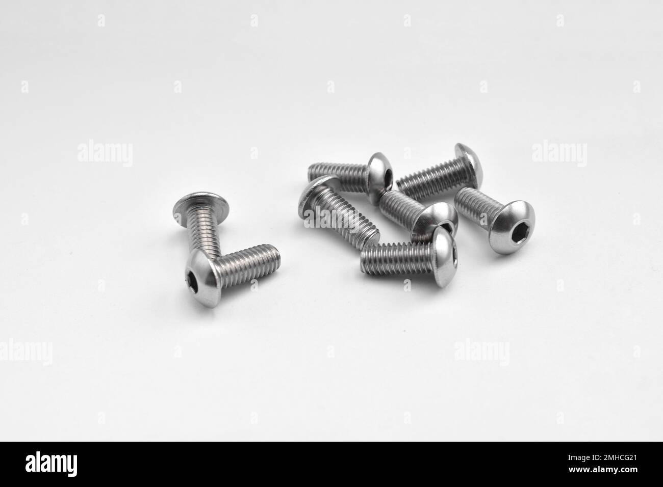Group of button hex head screw stainless steel isolated on white