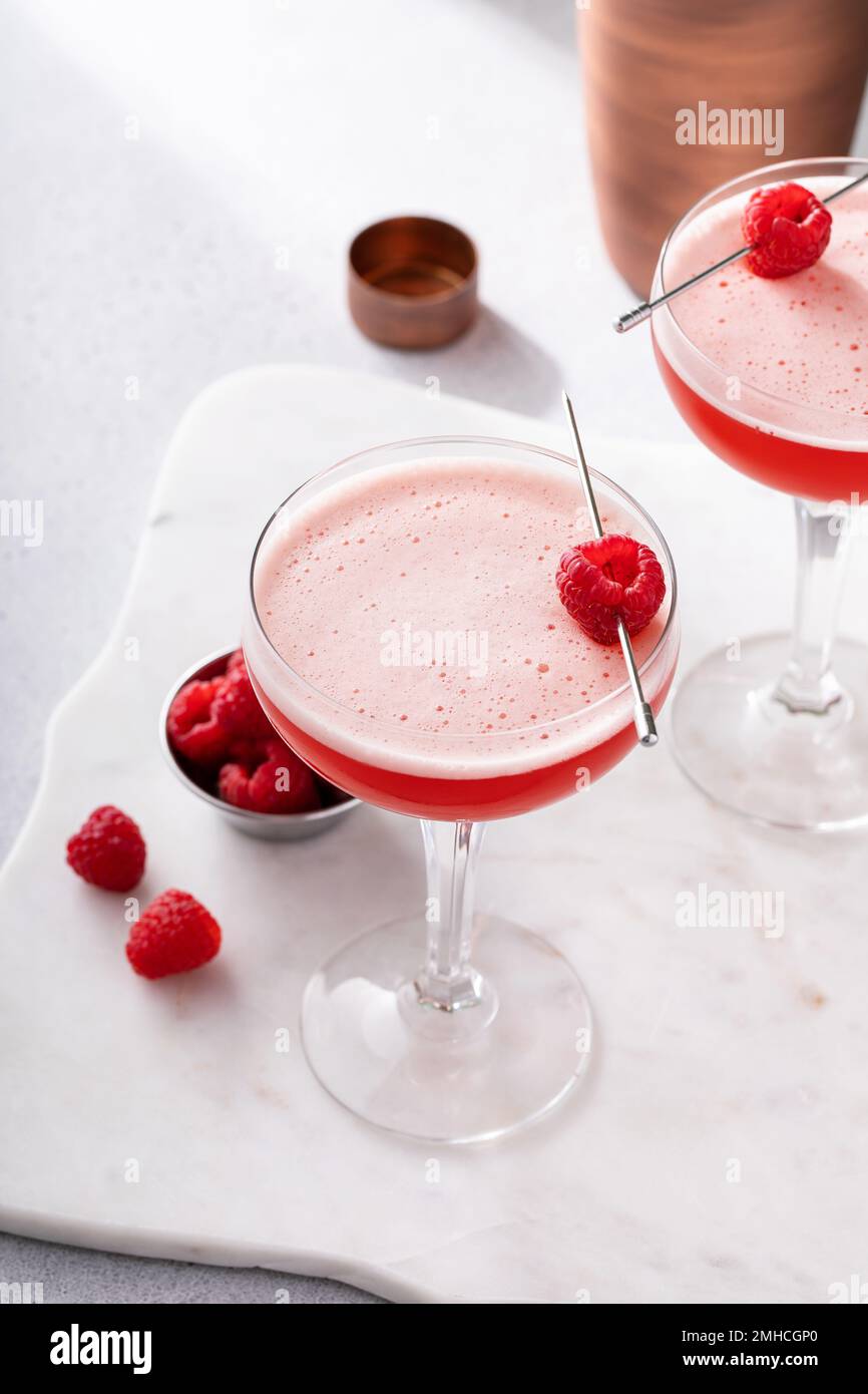 Raspberry martini cocktail with vodka, juice and raspberry liqueur Stock Photo