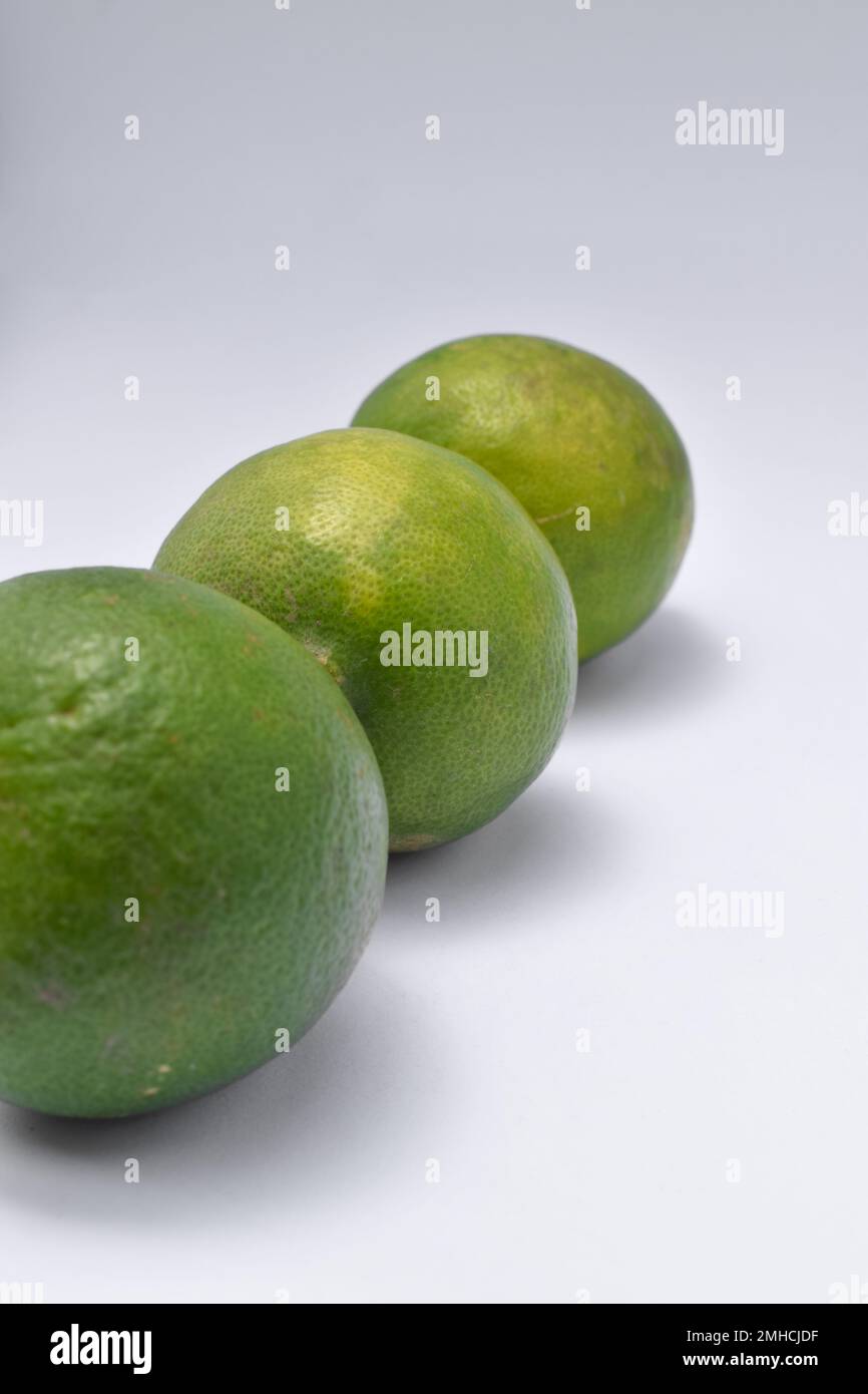 three limes isolated on a white background. used enough light with studio shot Stock Photo