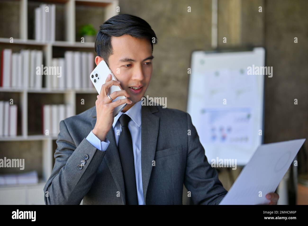 Handsome and professional millennial Asian businessman in formal ...