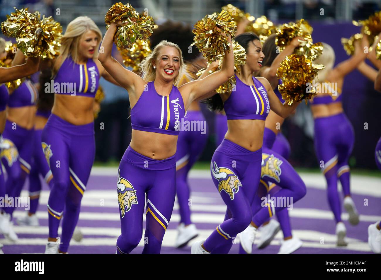 A Minnesota Vikings cheerleader performs during the first half of