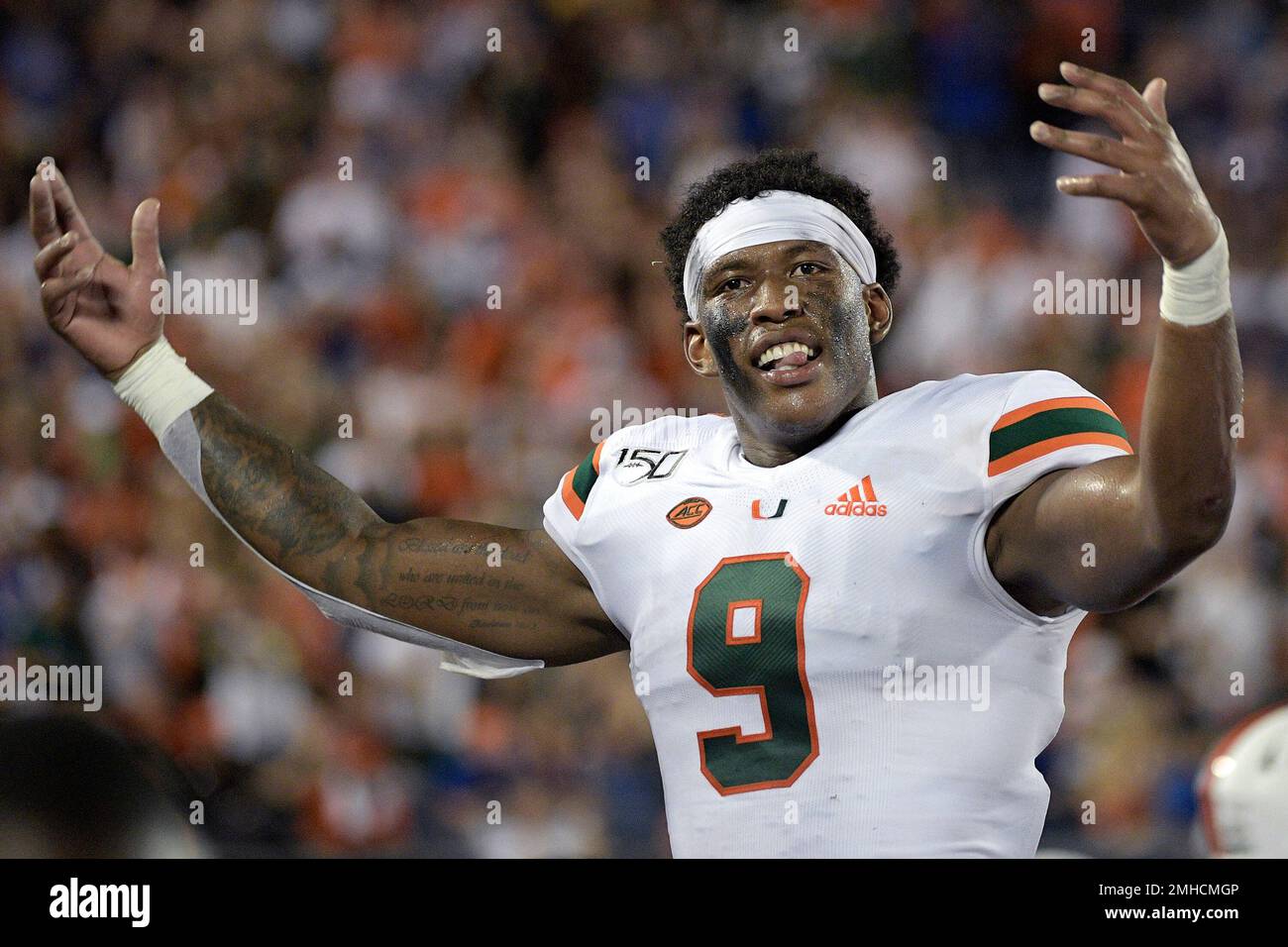 FILE In this Aug. 24 2019 file photo Miami tight end Brevin Jordan 9 celebrates on the sideline after a play during the second half of an NCAA college football game