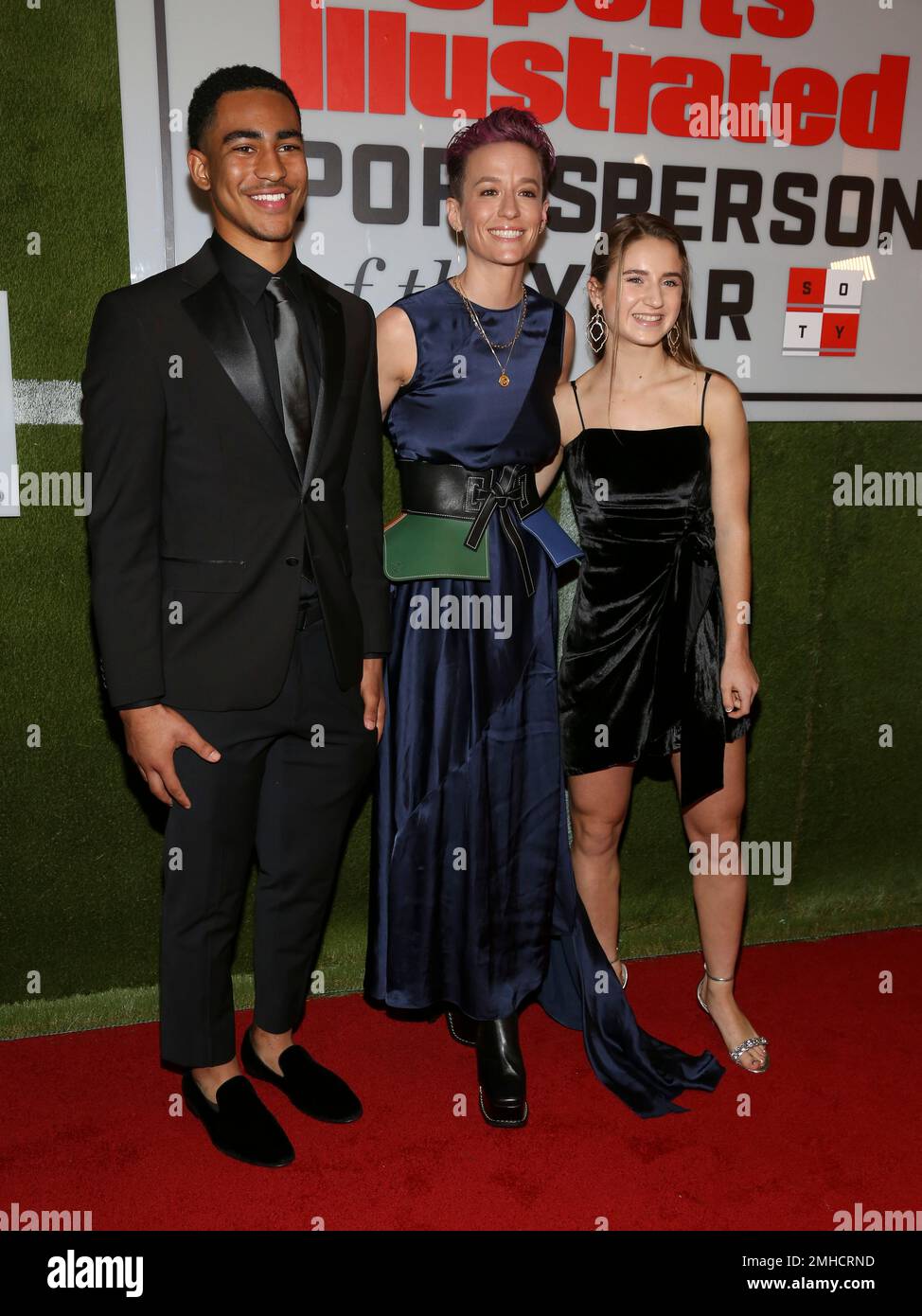 Bryce Young, from left, Megan Rapinoe and Ally Sentnor attend the