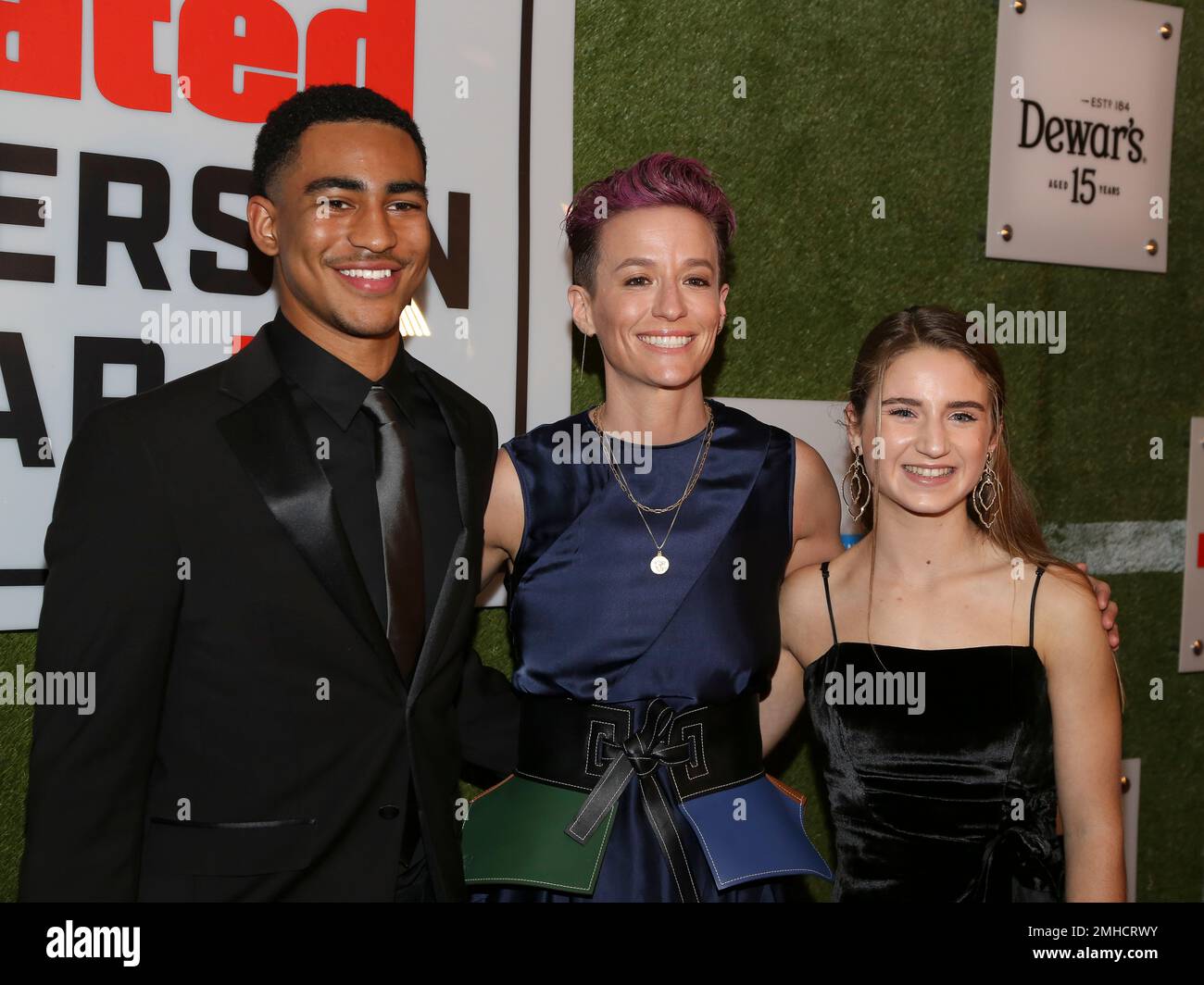 Bryce Young, from left, Megan Rapinoe and Ally Sentnor attend the