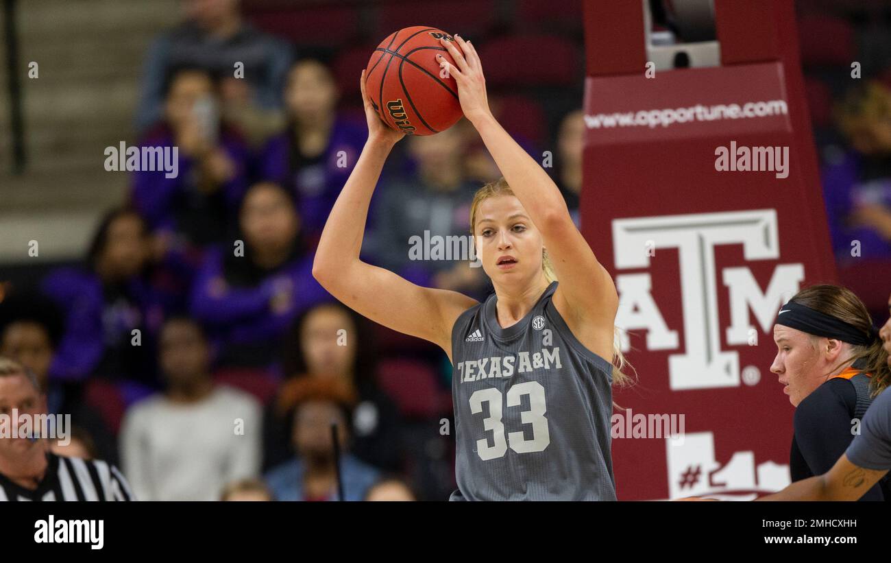 Texas A M center Anna Dreimane 33 looks to pass the ball against