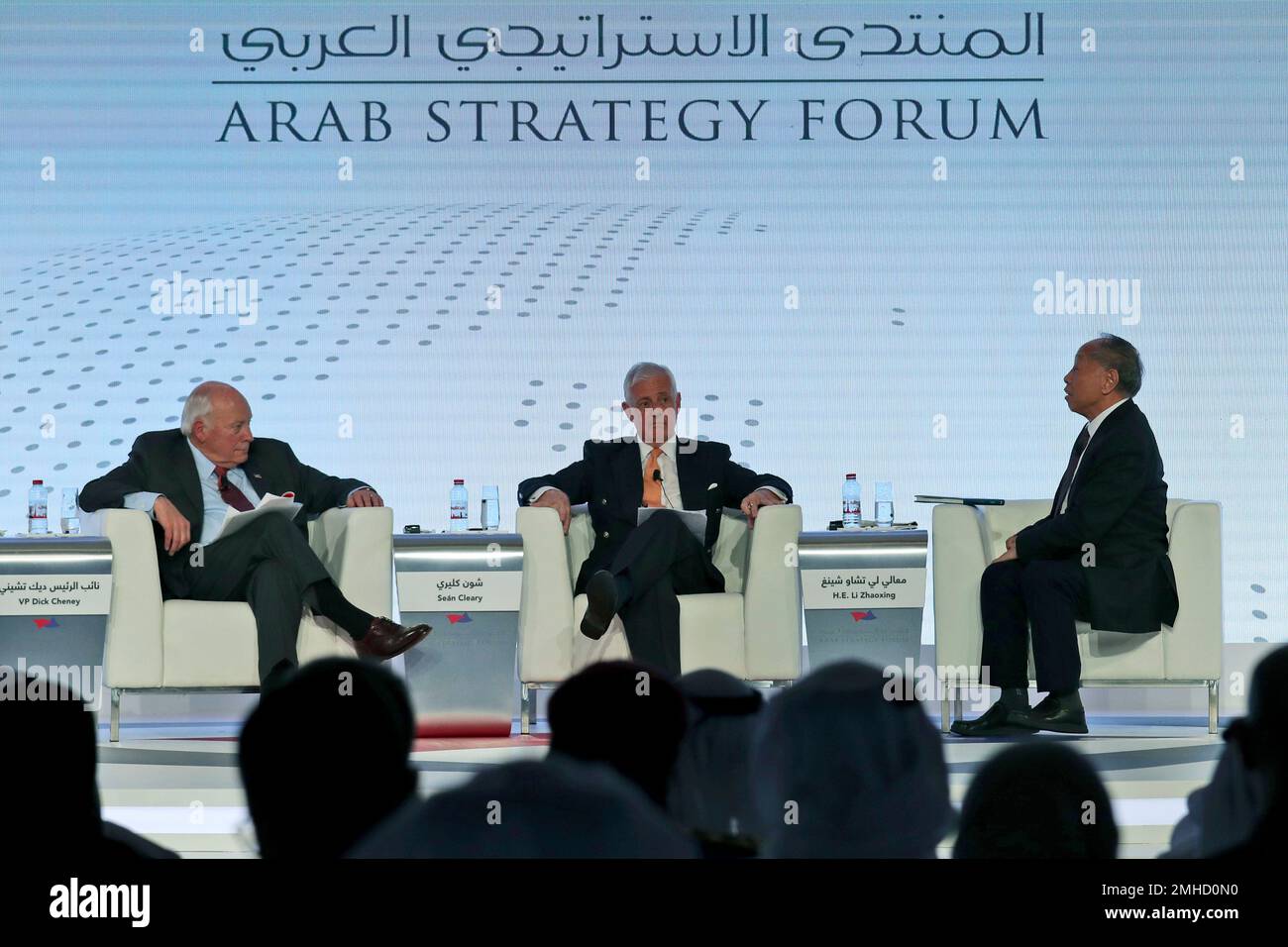 Former Chinese Foreign Minister Li Zhaoxing, right, talks to former U.S.  Vice President Dick Cheney, left, at the Arab Strategy Forum in Dubai,  United Arab Emirates, Monday, Dec. 9, 2019. (AP Photo/Kamran