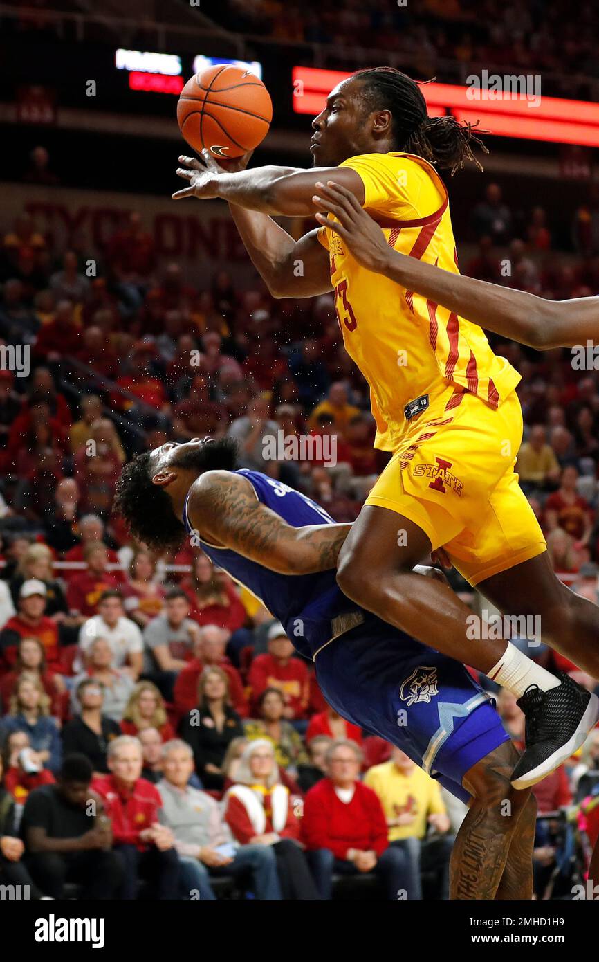 Iowa State forward Solomon Young, right, drives to the basket past
