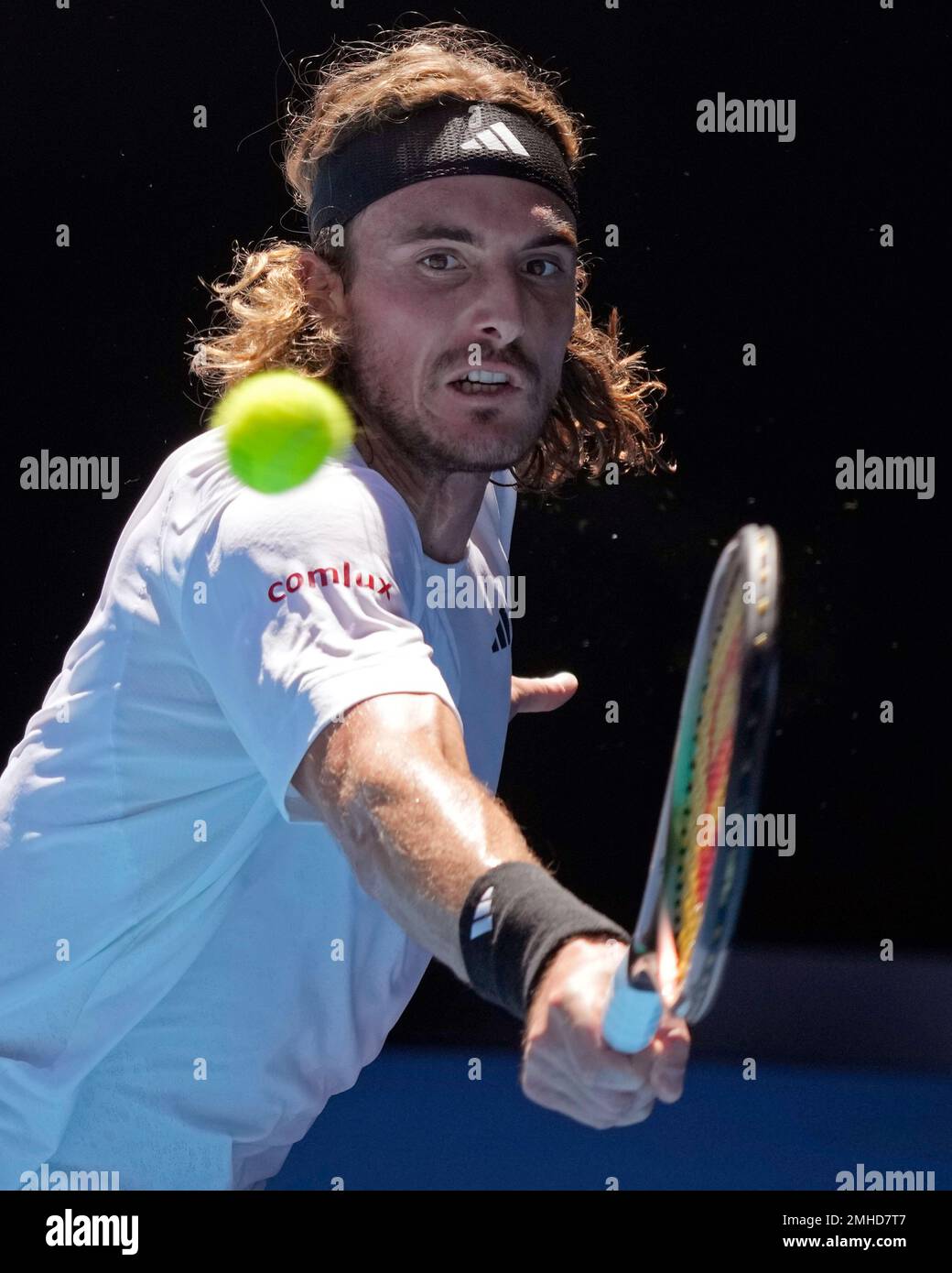 Stefanos Tsitsipas of Greece plays a backhand return to Karen Khachanov of Russia during their semifinal at the Australian Open tennis championship in Melbourne, Australia, Friday, Jan