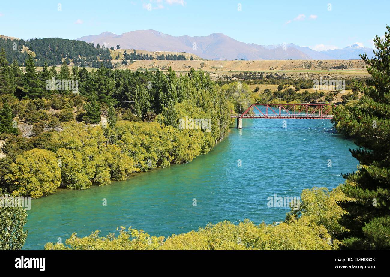 Clutha River with red bridge - New Zealand Stock Photo