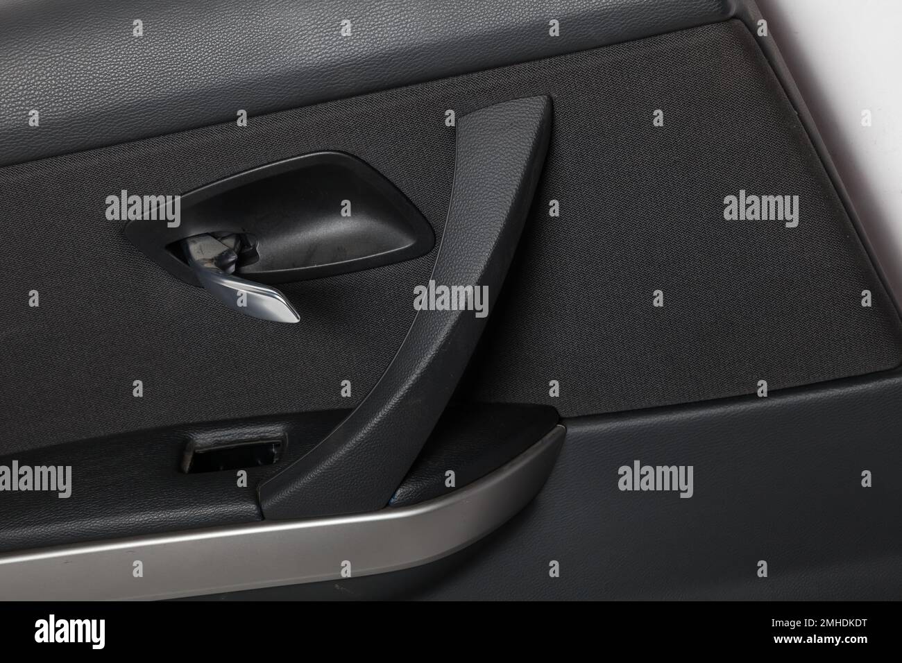 Car door trim with black fabric upholstery on a white isolated background for repair and