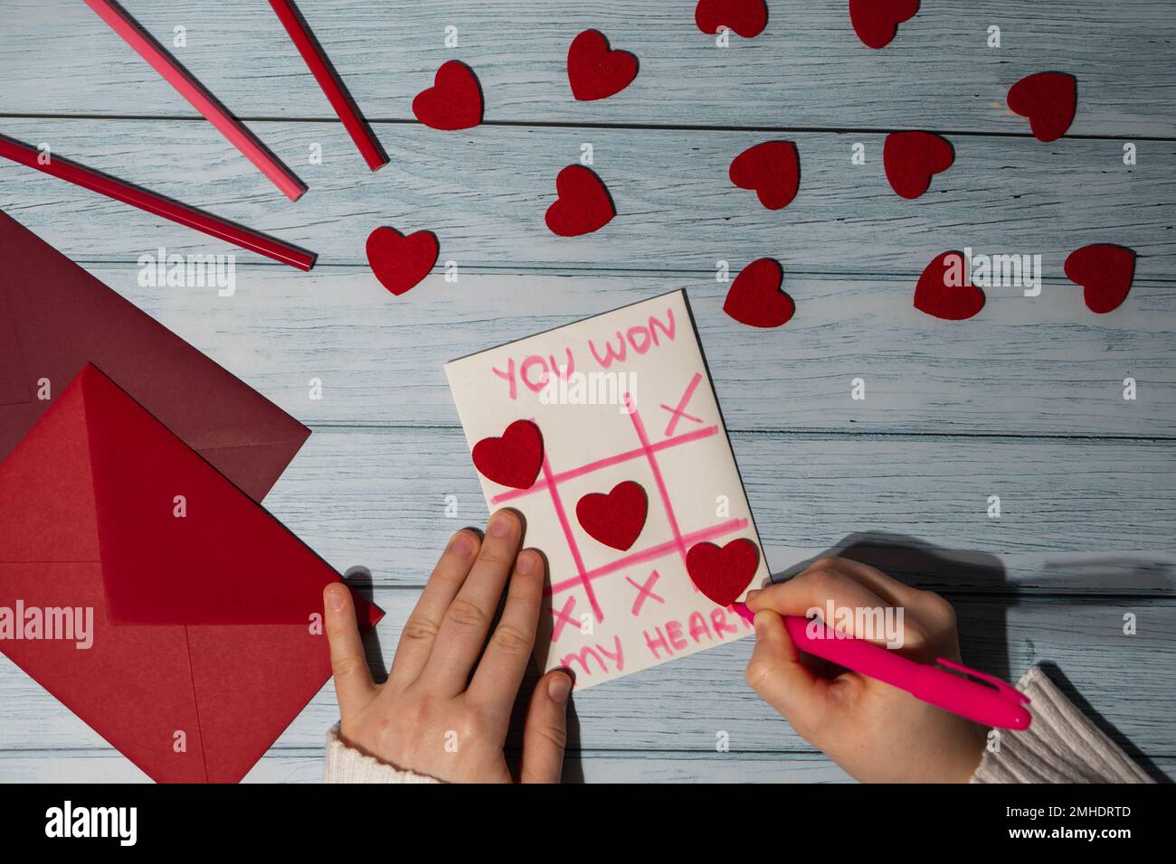 Valentines Day. Instructions for making valentine cards. Text YOU WON MY HEART and tic tac toe game Postcard craft greeting card. DIY Step by step instruction. Making of handmade Valentine greeting ca...