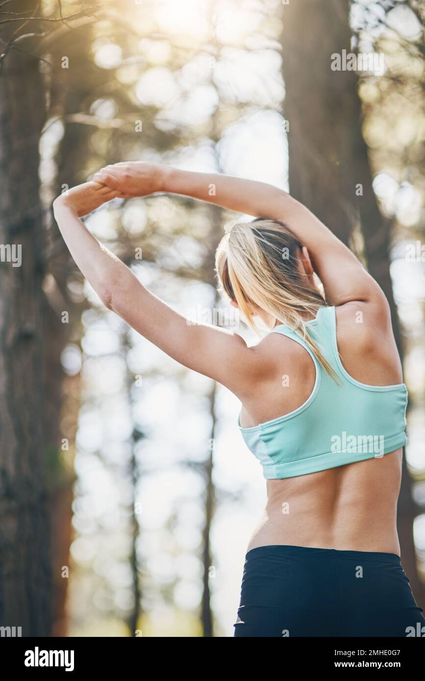 Young woman stretching arms hi-res stock photography and images - Alamy